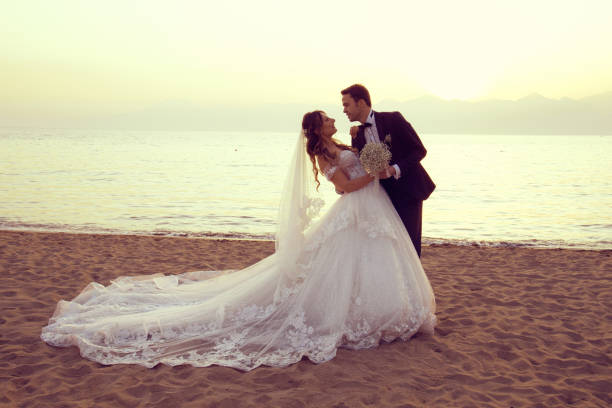 istock Beautiful just married couple at sunset. 1289949796