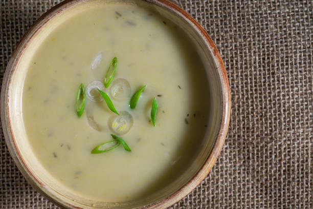 istock Leek soup garnished with green onions and sliced shallots. 1289950630