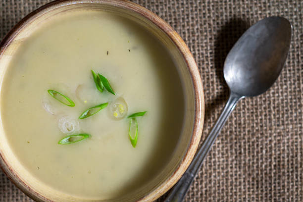 istock Leek soup garnished with green onions and sliced shallots. 1289950698