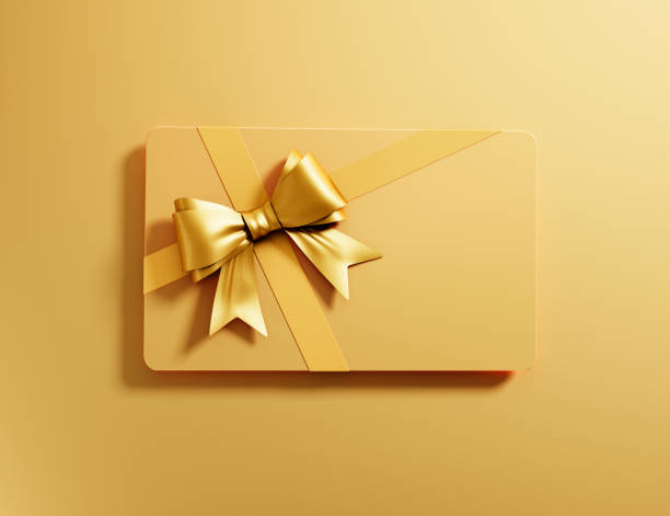 karta podarunkowa z wiązaną kokardką - gift card gift certificate gift gold zdjęcia i obrazy z banku zdjęć