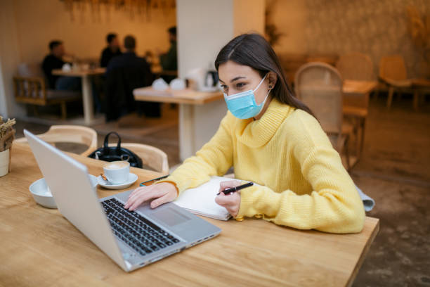 istock Beautiful young Caucasian female freelancer casually working 1289952006