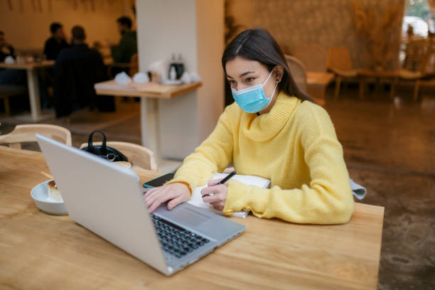istock Beautiful young Caucasian female freelancer casually working 1289952053