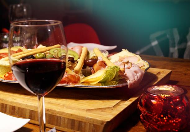 istock Various antipasti and a glass of red wine 1289952552