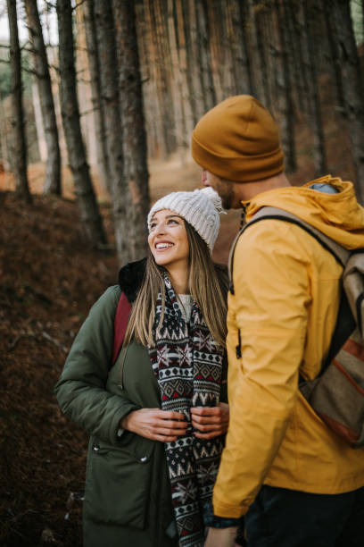 istock Beautiful couple is having fun and smiling in the woods 1289956733