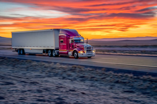 istock Red Cab Tanker Truck Speeding Down Interstate Seventy in Utah 1289957963