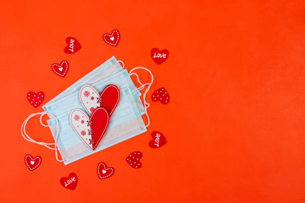 istock Medical protective masks and red hearts. 1289958540