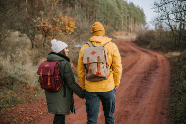 istock Couple is talking a walk, hugging and enjoying in the nature. 1289959325