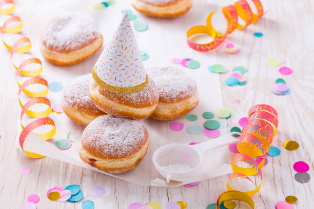 istock Traditional Berliner with party hat for carnival and party. 1289960407