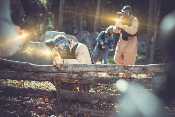 istock People in full gear playing paintball 1289962628