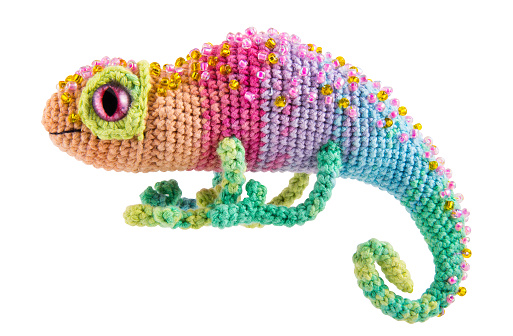 Beautiful rainbow chameleon, knitted toy
