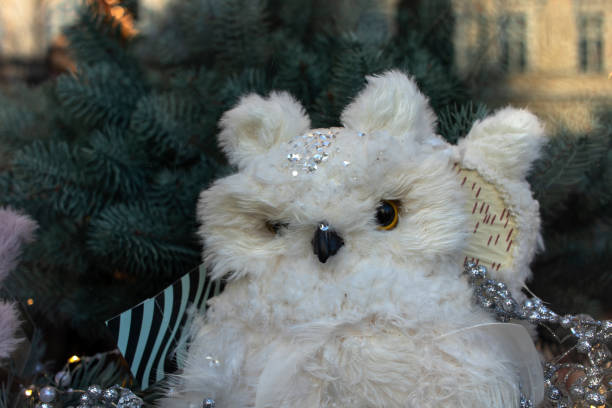 istock White toy owl on a Christmas tree. 1289964494