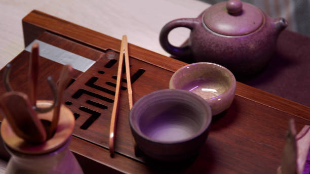 istock Complete set for a real chinese tea ceremony. Tea utensils, cups, glasses, teapot made of porcelain, a bag with dry leaves of the drink 1289967385