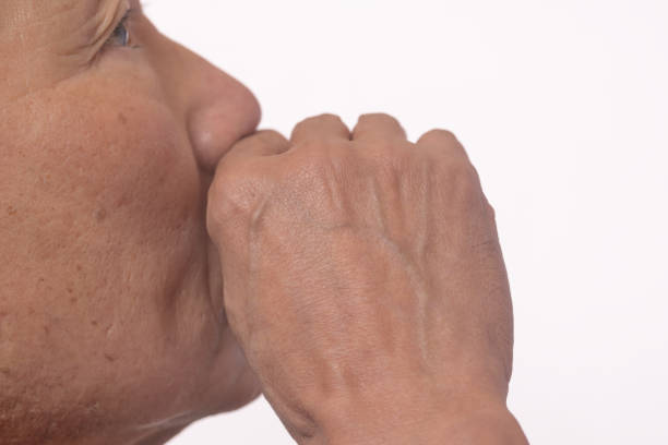 Japanese senior holding his nose with his hand
