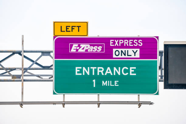 Reston, USA - May 14, 2018: EZPass EZ Pass exit lane for toll with sign text for entrance and left turn in Virginia