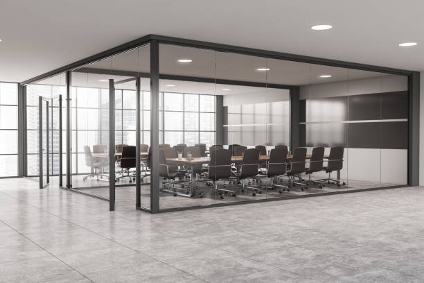istock Gray and glass office meeting room corner 1289979115