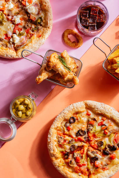 istock Italian pizza with vegetables, chicken wings, potatoes, sauce 1289980049