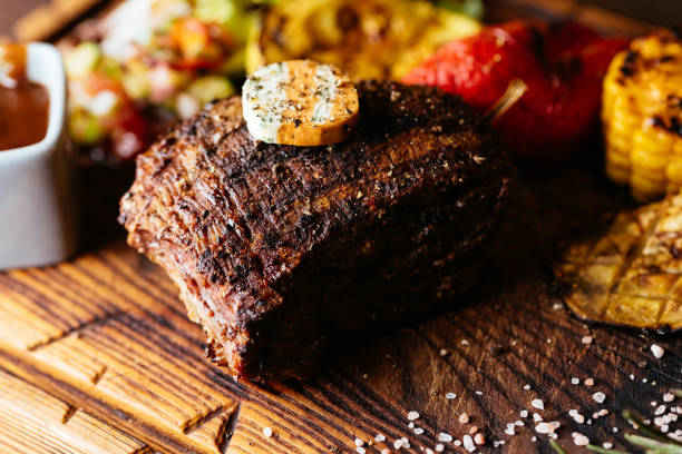 istock juicy beef steak on a wooden Board 1289980061