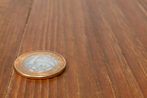 istock Brazilian Real coin on a wood table 1289980964
