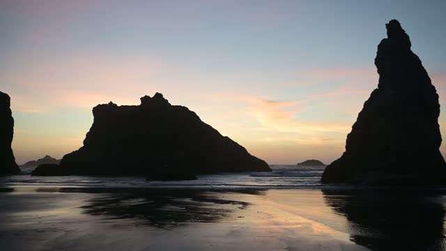Panning Video of Bandon Beach Oregon Coastal Landscape in Silhouette at Dusk