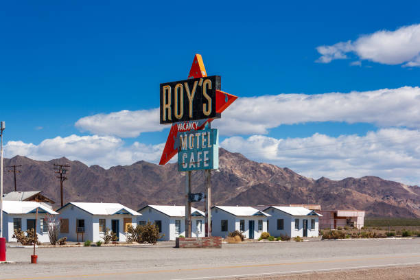 Amboy, CA / USA – April 1, 2017: View of the historical Roy’s Motel sign and small cabins located on Route 66 in Amboy, California.