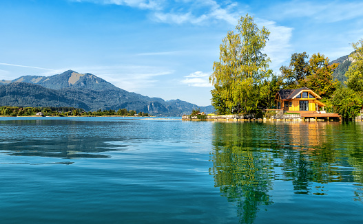A wide shot of a mountainous landscape reflecting over a lake Riessersee in Garmisch, Germany.