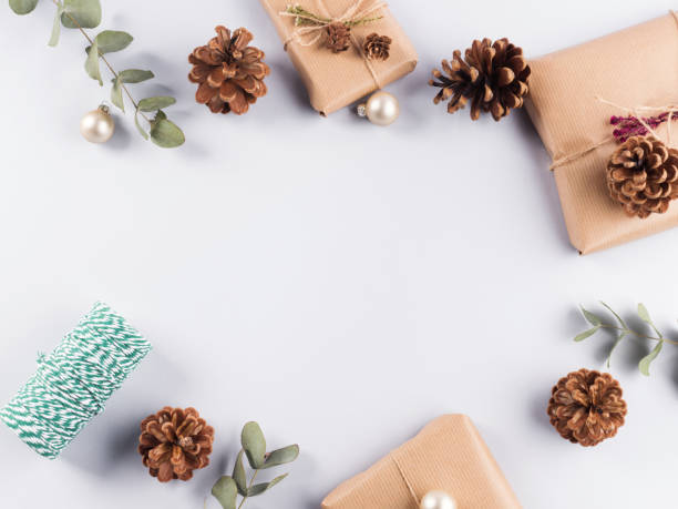 istock Christmas festive frame with presents, pine cones 1289990308