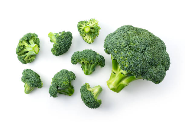 istock Close-up of cut broccoli placed on a white background 1289991738