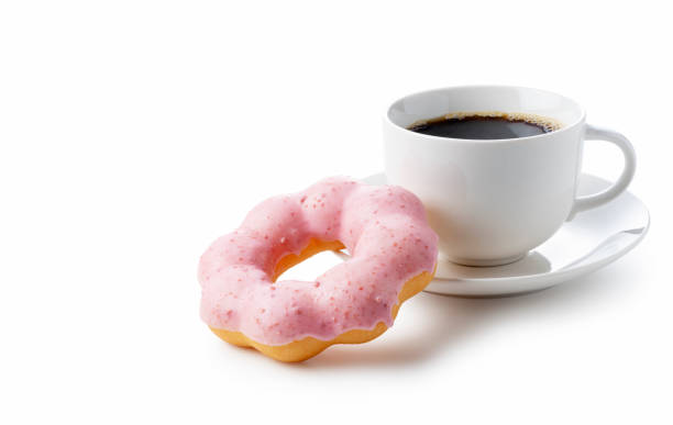 istock Hot coffee with pink doughnuts on a white background 1289992022