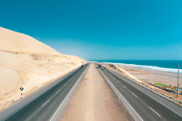 panamericana road with pacific ocean, aerial view panamericana in cañete, perú. - asphalt highway desert valley imagens e fotografias de stock