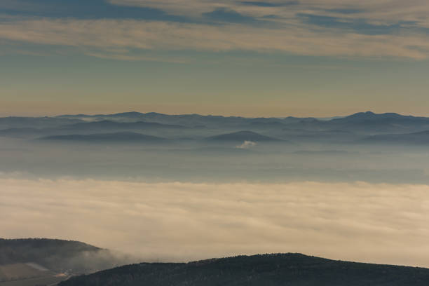 istock many mountains and dense fog in the landscape 1289997575