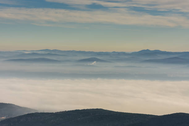 istock mountain landscape with dense ground fog and clouds 1289997577