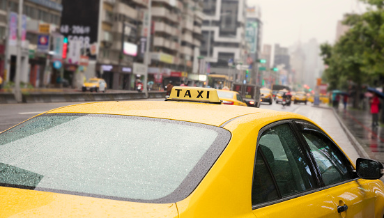 City life -on a rainy day in Taipei with close up on a taxi.