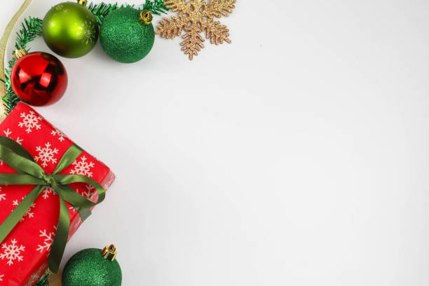 istock Christmas background with decorative ornaments and gift box on white background - copy space 1290006308