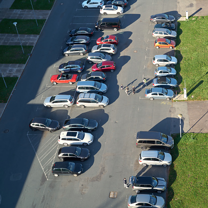 aerial view of the large parking lot with parked cars