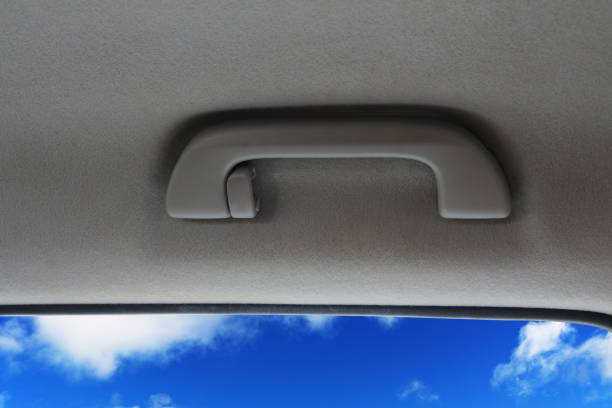 The handle is inside the car roof. stock photo