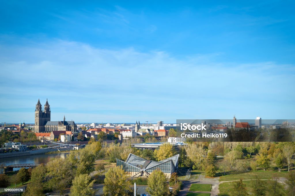 Panorama of the city of Magdeburg with the Rothehornpark and the Magdeburg Cathedral Panorama of the city of Magdeburg on the Elbe Cycle Route with the Rothehornpark and the Magdeburg Cathedral on the other side of the Elbe River Magdeburg Stock Photo