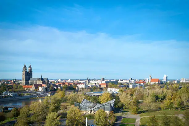 Panorama of the city of Magdeburg on the Elbe Cycle Route with the Rothehornpark and the Magdeburg Cathedral on the other side of the Elbe River