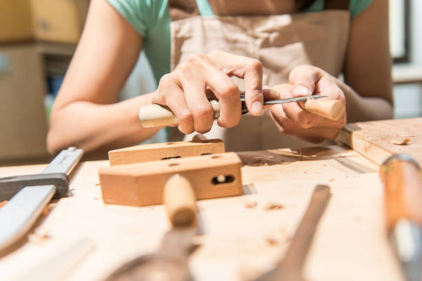 istock woman carpentry at home, wooden work concept 1290009229