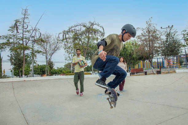 Friends skating in skate park