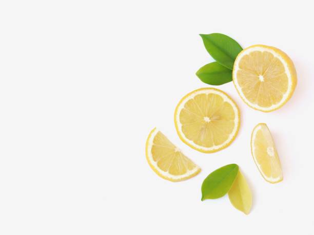 istock Sliced of lemon and leaf on white background 1290010367