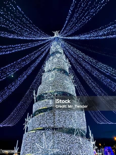 New Year Tree With Christmas Lights Decoration Winter Holiday Illumination Stock Photo - Download Image Now