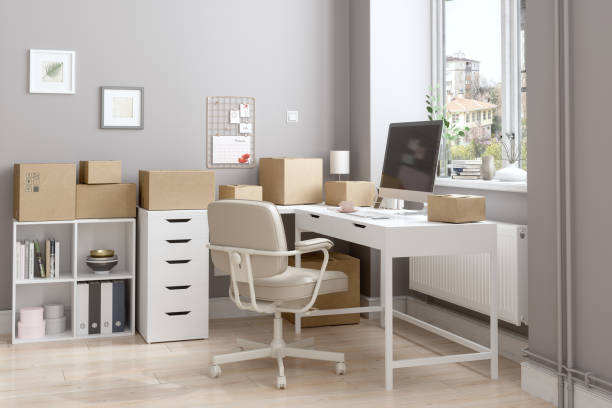 istock Working From Home According To New Normal With Cardboard Boxes Prepared To Be Sent 1290015375