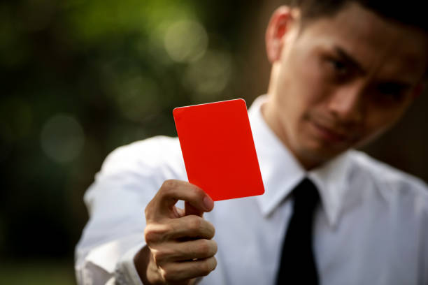 istock Male employee issuing a red card 1290017236