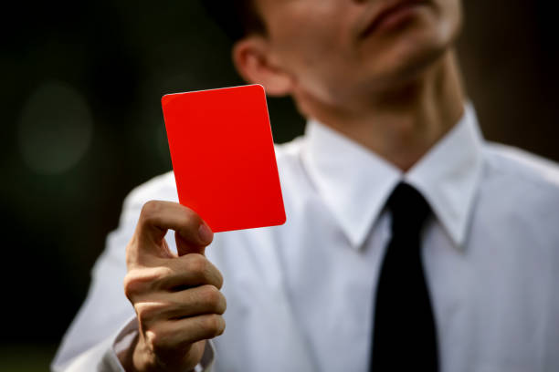istock Male employee issuing a red card 1290017366