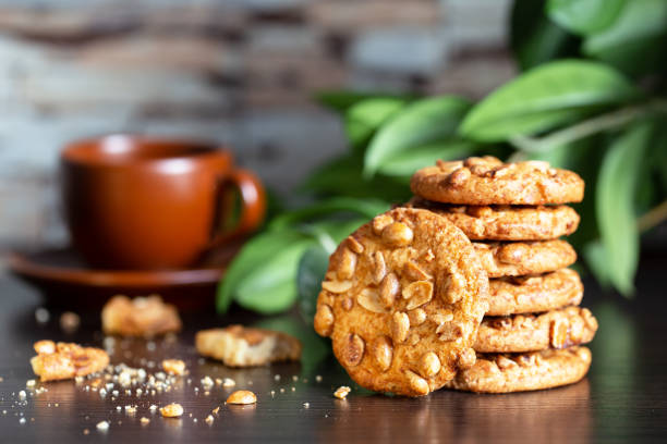istock Oatmeal cookies with nuts on table with cup of coffee 1290017580