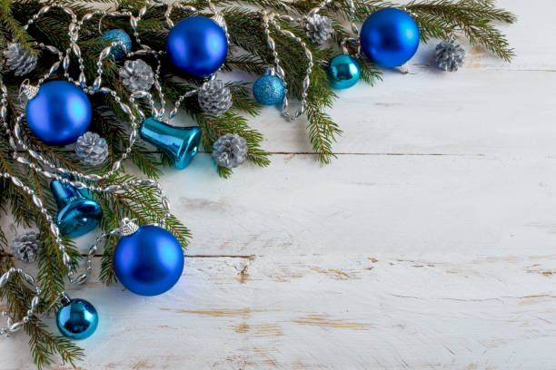 istock Christmas blue balls background wooden 1290018205