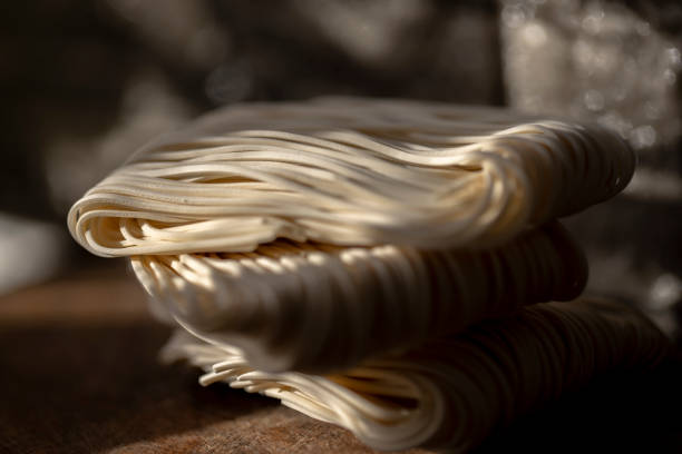 istock dry and raw Chinese noodles, ready for cook 1290018692