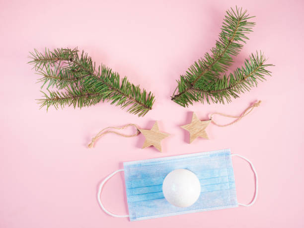 istock Reindeer made with face mask and christmas decorations 1290022520