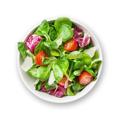 Fresh healthy salad in bowl. Isolated on white background. Top view flat lay