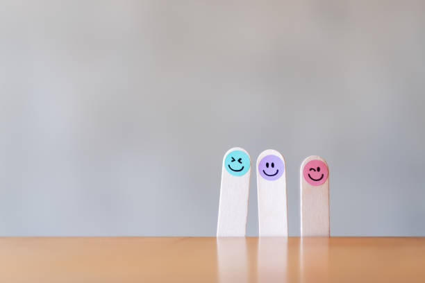 istock Colorful hand draw happy emotion faces on wooden stick 1290024585